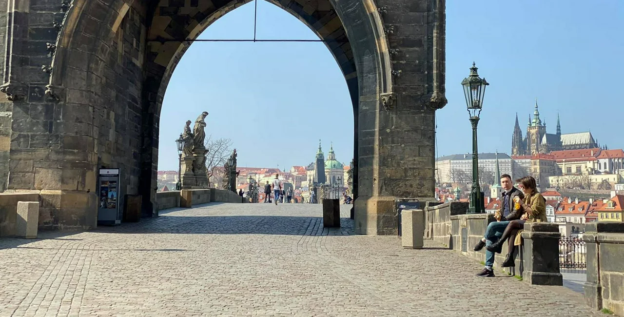 A mostly empty Charles Bridge in Prague during quarantine measures via Lucas Nemec