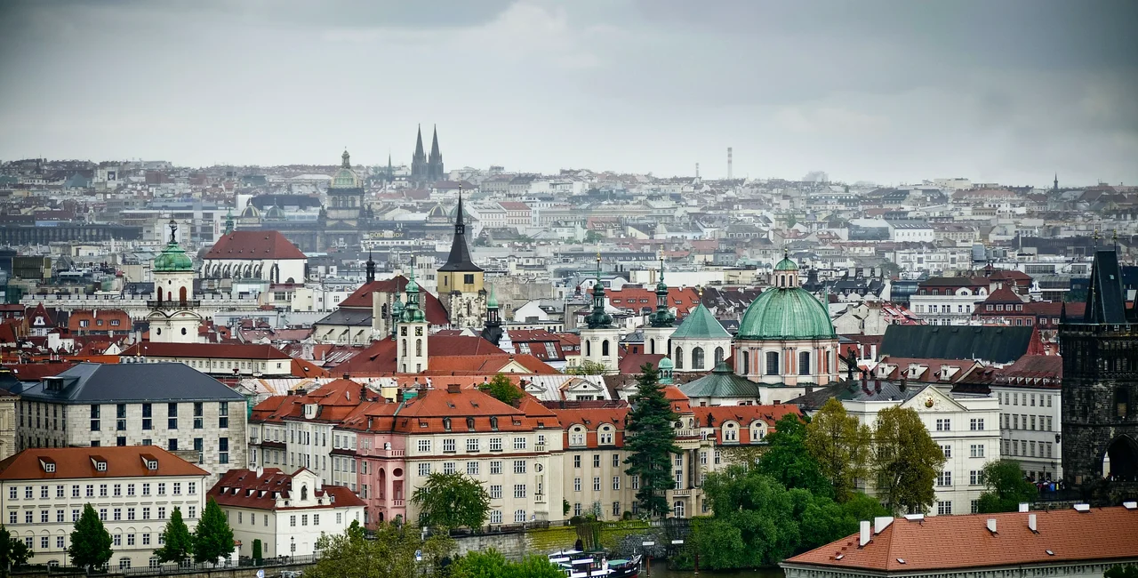 Illustrative image of Prague with looming storm clouds. Wiwid Kuntjoro on Unsplash