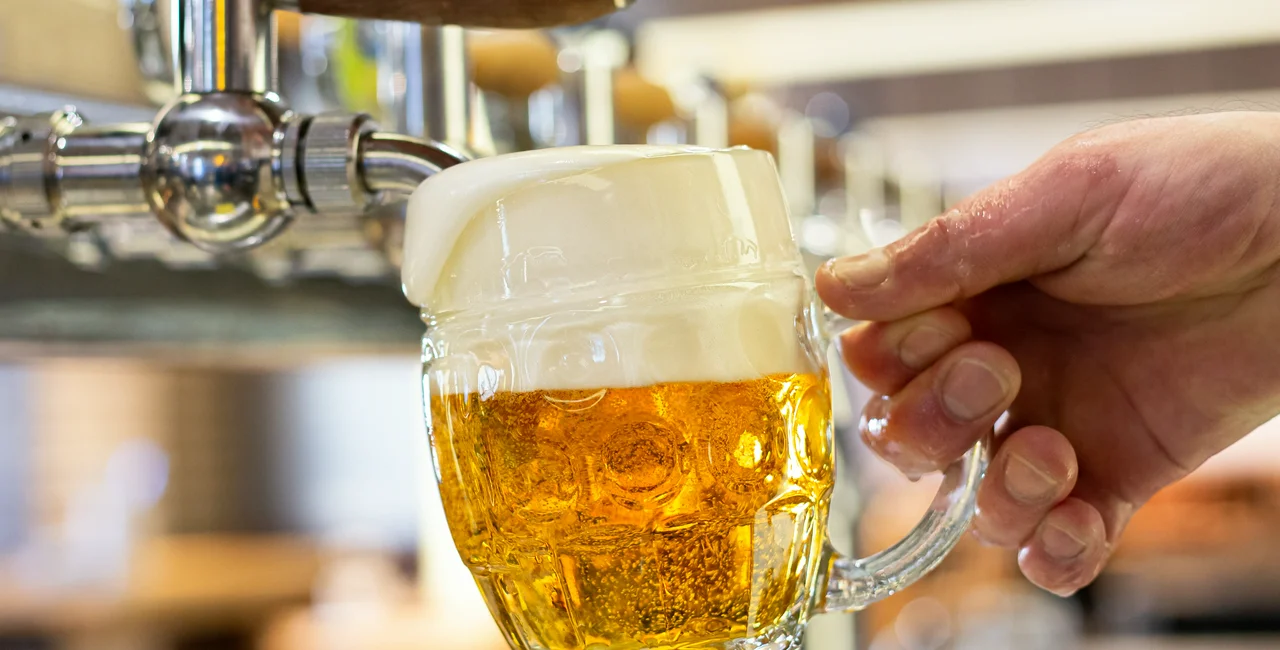 Pouring a beer. Photo: Shutterstock / Moving Moment