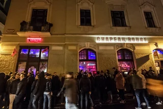 Crowds gather outside Prague bar Chapeau Rouge. Photo: Shutterstock /