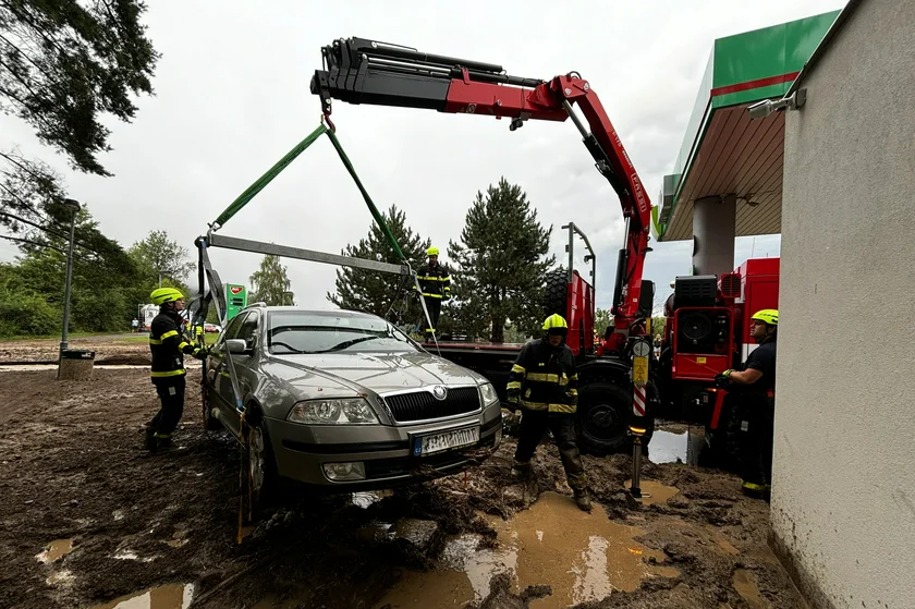 Firefighters rescuing an entrapped car in the Czech town of