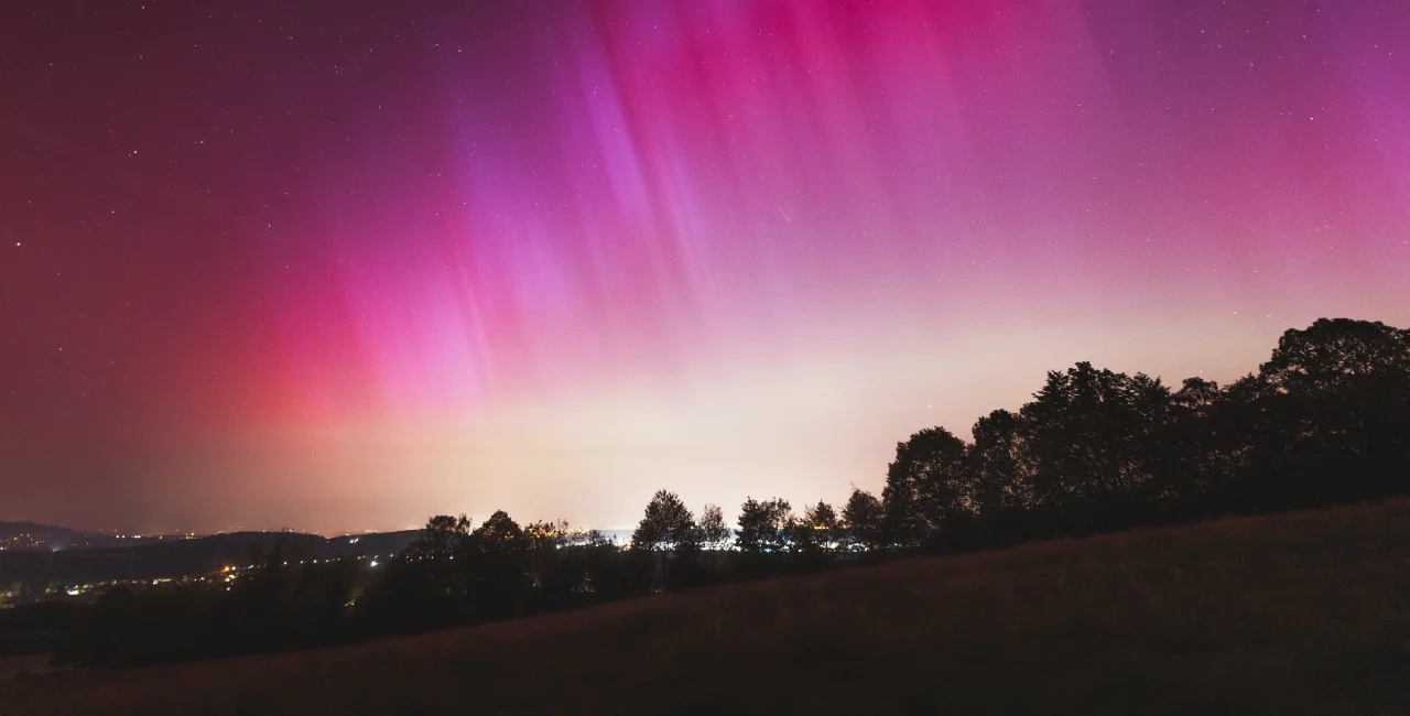 Northern lights (aurora borealis) over the Czech countryside. Photo: Shutterstock / Vaclav Sonnek